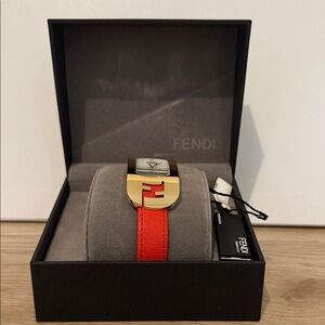 Fendi Chameleon Womany Watch with Orange Strap and Gold Face